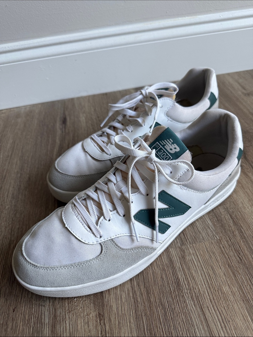 New Balance Men's Sneakers in White with Teal Accents